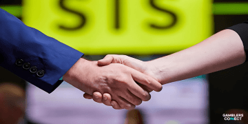 A close-up of a business handshake in front of the SIS logo, symbolizing the partnership extension between Sports Information Services and Doncaster Greyhound Stadium.