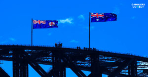 Two Australian flags flying proudly over the Sydney Harbour Bridge, representing Australia's national self-exclusion register, BetStop, and its user data.