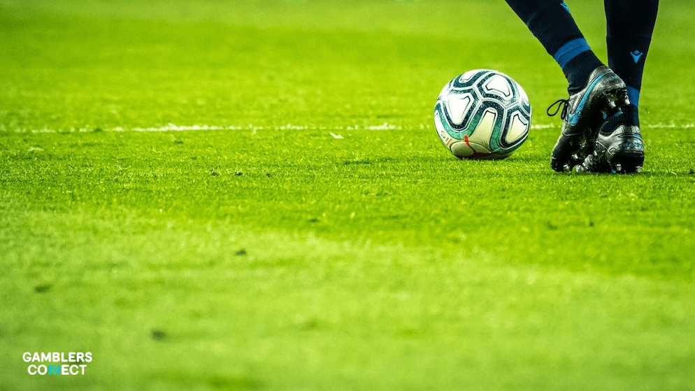 A digital screen displaying a graph with a red line indicating the rise of unregulated betting activity against a dark background.