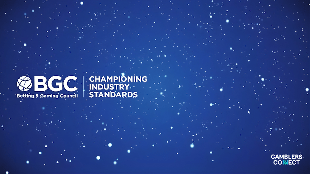 A close up view of colorful casino poker chips representing the financial stakes and tax burdens facing the gambling industry.