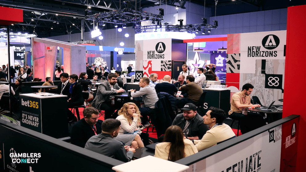 The stylish interior of Ikibana Sarrià in Barcelona filled with industry delegates networking and collecting badges during the iGB Affiliate Welcome Drinks.