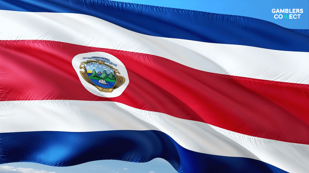 A detailed view of the Costa Rican flag, symbolizing the ongoing political division regarding the modernization of the country's 50-year-old gambling laws.