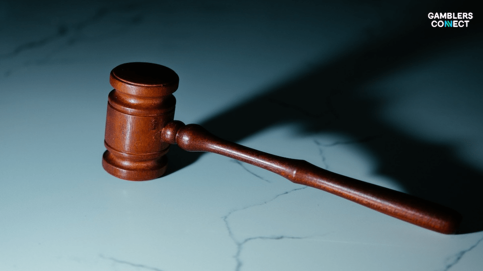 A wooden judicial gavel resting on a stone surface, symbolizing the lawsuit filed by Oxford Casino in U.S. District Court.
