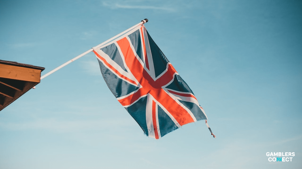 A close-up of the Union Jack flag flying outdoors, representing the national debate over the Finance Bill and its impact on the regulated betting sector.