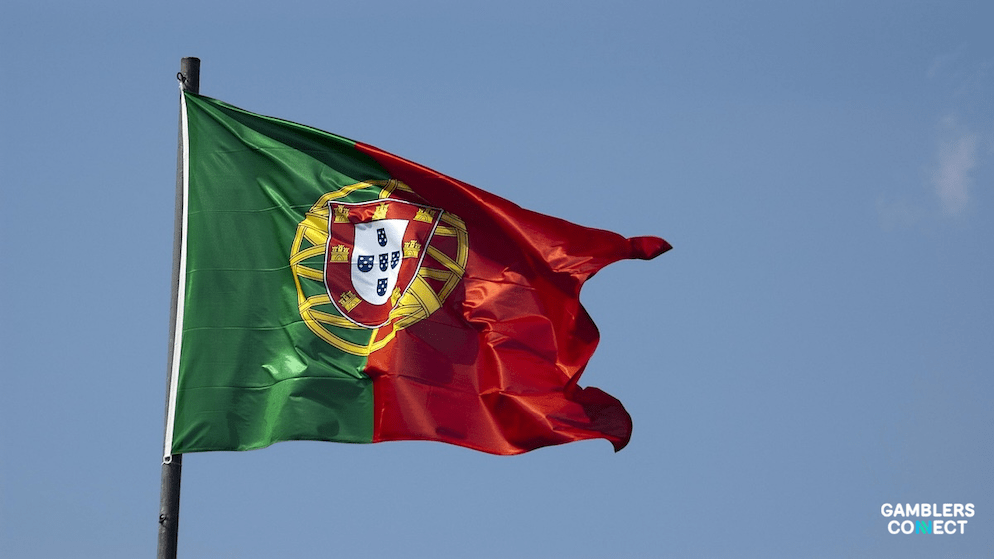 A close-up of the Portuguese flag, symbolizing the enforcement of national laws prohibiting betting on political events and the blocking of unauthorized platforms.