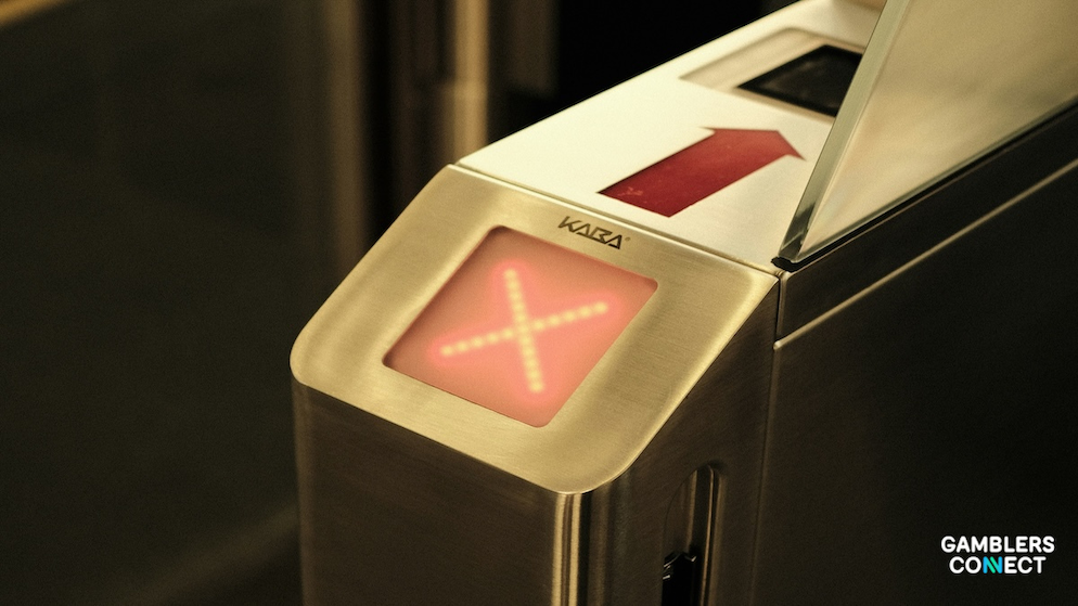 A turnstile with a red 'X' indicator, symbolizing the AGCO's proposed suspension of PointsBet Canada following a reporting failure in the Jontay Porter scandal.
