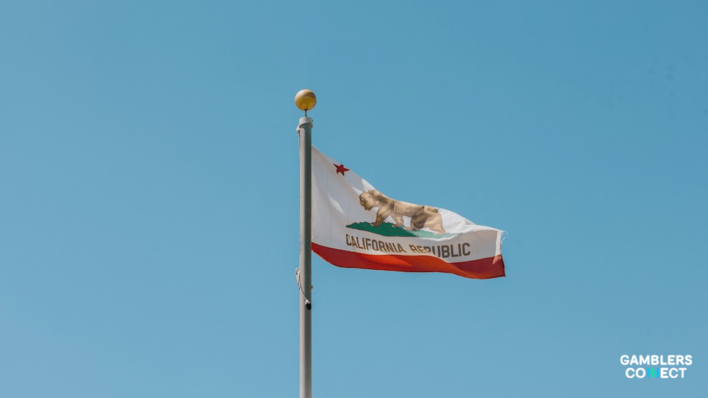 "Close-up of the California flag with the Gamblers Connect logo, illustrating the intersection of state authority and emerging sports wagering platforms."